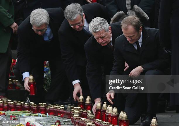 Polish President Bronislaw Komorowski , German President Joachim Gauck and European Council President Donald Tusk lay candles at ceremonies marking...