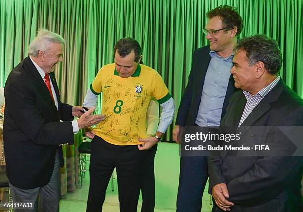 President of LOC 2014 Jose Maria Marin and FIFA Secretary General Jerome Valcke deliver an autographed shirt of the Brazilian team for Governor of...