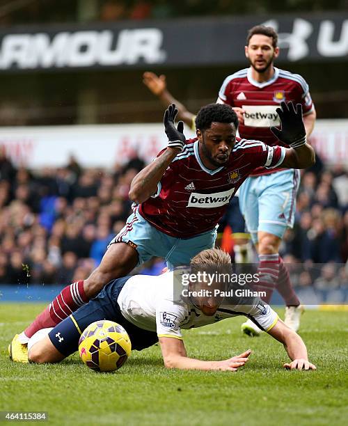 Harry Kane of Spurs goes down under the challenge from Alexandre Song of West Ham to win an injury time penalty during the Barclays Premier League...