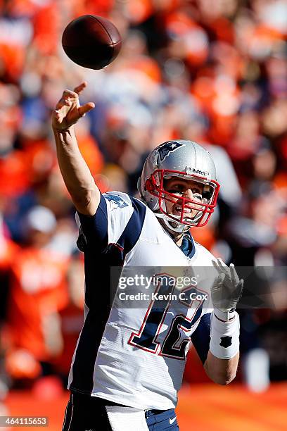 Tom Brady of the New England Patriots throws the ball against the Denver Broncos during the AFC Championship game at Sports Authority Field at Mile...