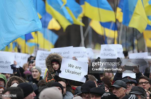 People, many bearinf Ukrainian flags, participate in the "March of Diginity" prior to ceremonies marking the first anniversary of the Maidan...