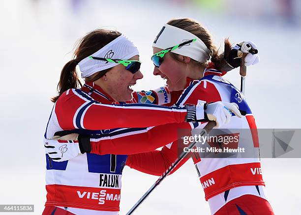 Maiken Caspersen Falla of Norway celebrates winning the gold medal with team mate Ingvild Flugstad Oestberg in the Women's Cross-Country Team Sprint...