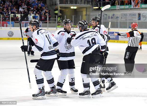 Alexander Oblinger, Fredrik Eriksson, Jason Jaspers and Marco Nowak of the Thomas Sabo Ice Tigers Nuernberg celebrate after scoring the 0:2 during...