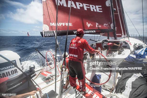 In this handout image provided by the Volvo Ocean Race onboard MAPFRE, Andre Fonseca on the helm, Carlos Hernandez on the main and Rafael Trujillo on...