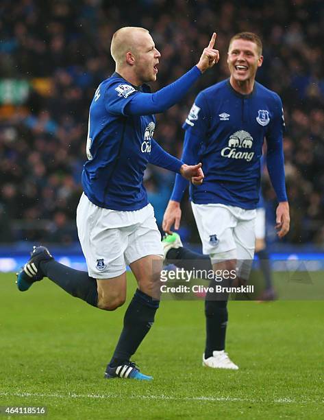 Steven Naismith of Everton celebrates with James McCarthy as he scores their first goal during the Barclays Premier League match between Everton and...