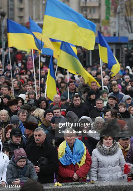 People, some bearing Ukrainian flags, attend ceremonies marking the first anniversary of the Maidan revolution that led to the ouster of Ukrainian...