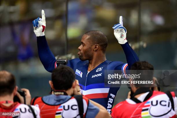 France's Gregory Bauge celebrates after winning gold in the Men's Sprint finals at the UCI Track Cycling World Championships in...