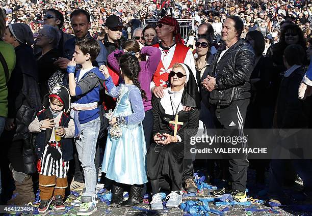 Onlookers watch the parade during the Nice Carnival on February 22, 2015 in Nice, southeastern France. The carnival runs through February 13 - March...