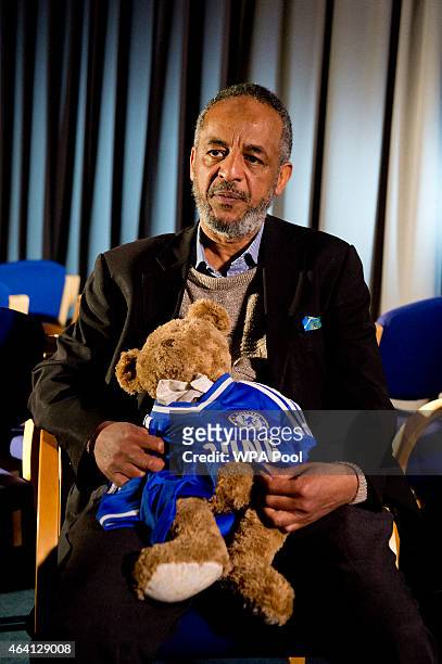 Abase Hussen, father of Amira Abase holds a bear that Amira gave her mother as he is interviewed by the media at New Scotland Yard, as the relatives...