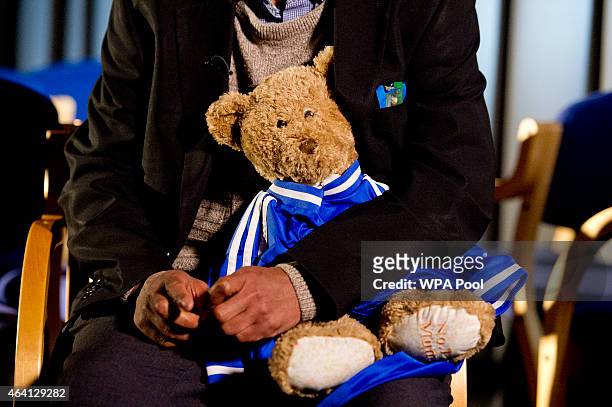 Abase Hussen, father of Amira Abase holds a bear that Amira gave her mother as he is interviewed by the media at New Scotland Yard, as the relatives...