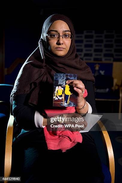 Renu Begum, eldest sister of Shamima Begum holds her sister's photo as she is interviewed by the media at New Scotland Yard, as the relatives of...