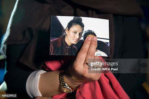 Renu Begum, eldest sister of Shamima Begum holds her sister's photo as she is interviewed by the media at New Scotland Yard, as the relatives of...