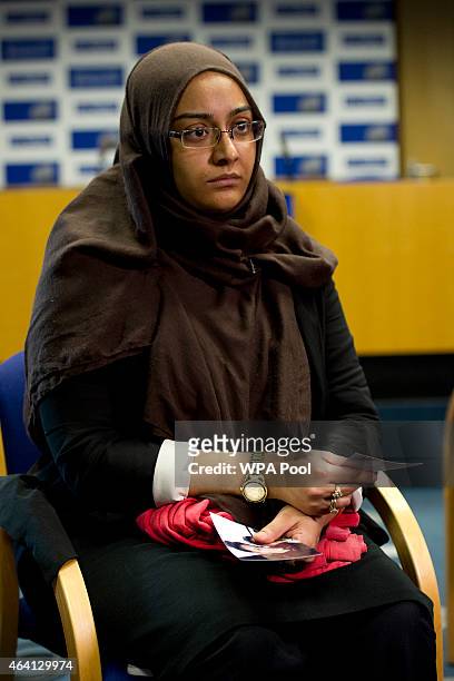 Renu, eldest sister of Shamima Begum holds her sister's pajamas and photos while being interviewed by the media at New Scotland Yard, as the...