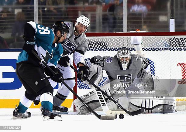 Jonathan Quick of the Los Angeles Kings defends against Logan Couture of the San Jose Sharks during the 2015 Coors Light NHL Stadium Series game at...