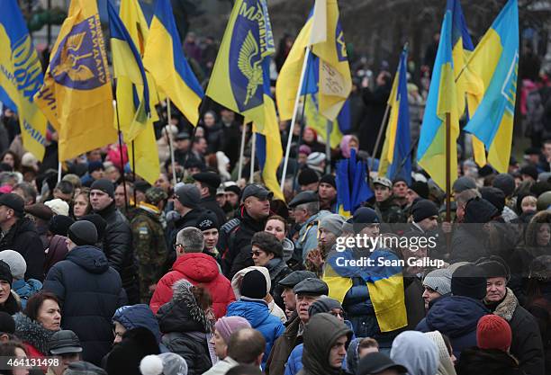 People, some bearing Ukrainian flags, attend ceremonies marking the first anniversary of the Maidan revolution that led to the ouster of Ukrainian...