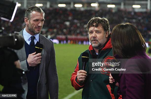 Actor and co-owner of South Sydney Rabbitohs Russell Crowe is interviewed by the BBC alongside Leeds Rhinos player Jamie Peacock prior to the World...