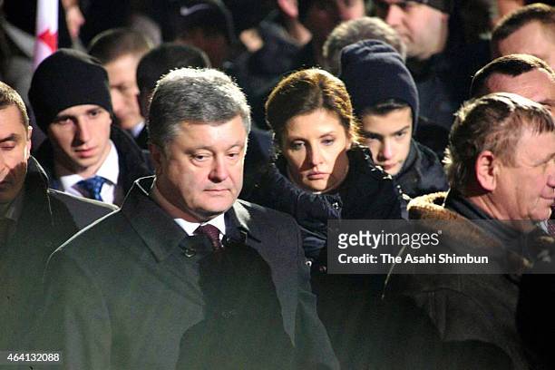 Ukrainian President Petro Poroshenko attends an evening ceremony to commemorate victims of the Maidan uprising one year ago at Maidan square on...