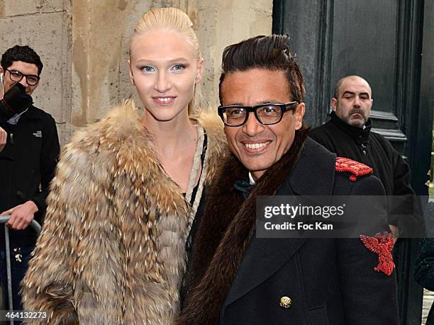 Omar Harfouch and Yulia Lobova attend the Christian Dior show as part of Paris Fashion Week Haute Couture Spring/Summer 2014 at Musee Rodin on...