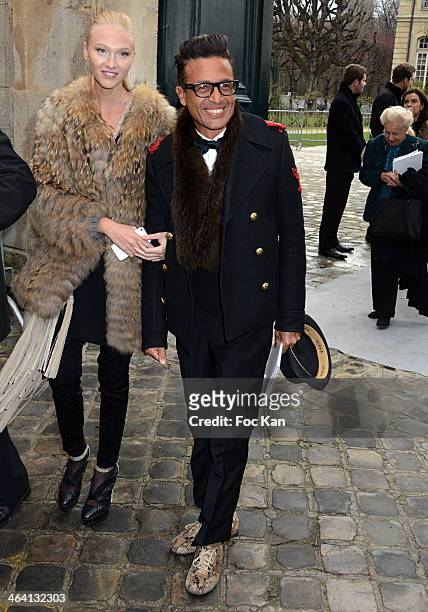 Omar Harfouch and Yulia Lobova attend the Christian Dior show as part of Paris Fashion Week Haute Couture Spring/Summer 2014 at Musee Rodin on...