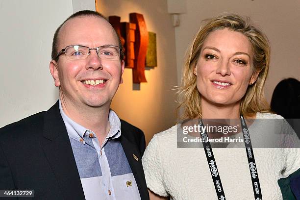 IMDb founder and CEO Col Needham and director Lucy Walker attend the IMDb Sundance dinner party at the Mustang on January 20, 2014 in Park City, Utah.