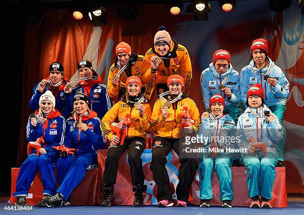 Gold medallists Richard Freitag, Severin Freund, Katharina Althaus and Carina Vogt of Germany pose with silver medallists Line Jahr, Anders Bardal,...