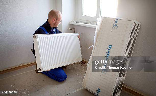 Refurbishment of an old building, installation of a new radiator in an old building on May 15 in Berlin, Germany. Photo by Thomas Koehler/Photothek...