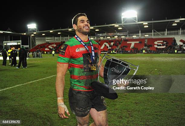 Captain Greg Inglis of South Sydney Rabbitohs celebrates with the trophy after victory in the World Club Challenge match between St Helens and South...