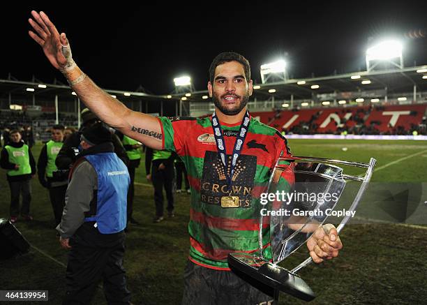 Captain Greg Inglis of South Sydney Rabbitohs celebrates with the trophy after victory in the World Club Challenge match between St Helens and South...