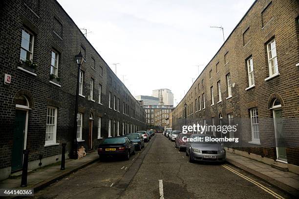 Automobiles sit parked in front of rows of residential terraced properties in the Waterloo district of London, U.K., on Monday, Jan. 20, 2014. London...