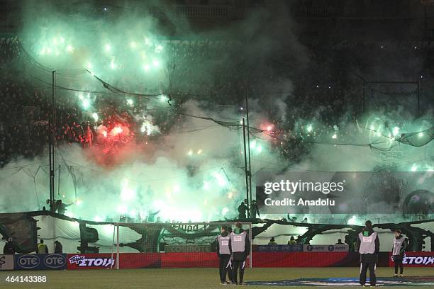 Panathinaikos fans show their support during Greek Super League match between Panathinaikos FC v Olympiacos at the Apostolos Nikolaides stadium in...