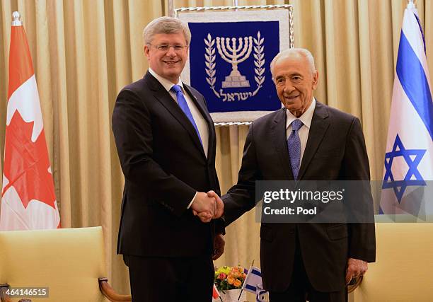 Canadian Prime Minister Stephen Harper meets with Israeli President Shimon Peres for a working meeting in the presidential residence on January 21,...