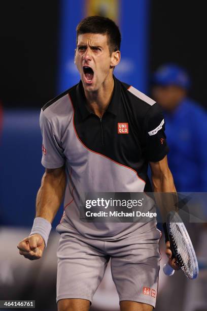 Novak Djokovic of Serbia celebrates a point in his quarterfinal match against Stanislas Wawrinka of Switzerland during the 2014 Australian Open at...
