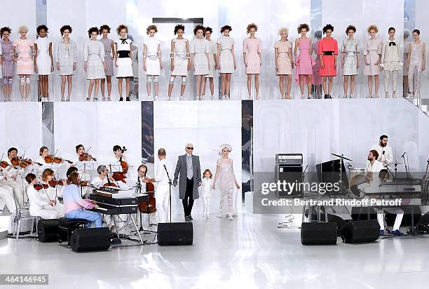 Fashion designer Karl Lagerfeld, his godson Hudson Kroenig and Model Cara Delevingne walk the runway at the end of the Chanel show as part of Paris...