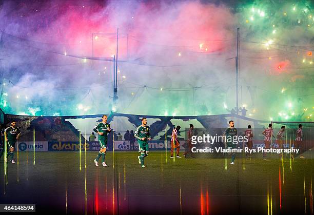 Teams enter the pitch ahead of the Superleague match between Panathinaikos FC and Olympiacos at Apostolos Nikolaidis Stadium on February 22, 2015 in...