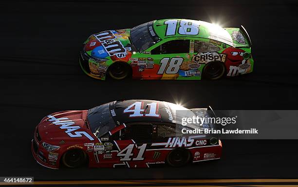 Matt Crafton, driver of the M&M's Crispy Toyota, races Regan Smith, driver of the Haas Automation Chevrolet, during the NASCAR Sprint Cup Series 57th...