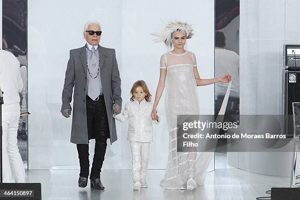 Karl Lagerfeld and Cara Delevingne walk the runway during the Chanel show as part of Paris Fashion Week Haute-Couture Spring/Summer 2014 on January...
