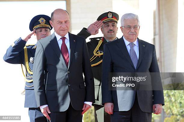 In this handout image supplied by the Palestinain Press Office , Palestinian President Mahmoud Abbas attends a welcome ceremony with Romanian...