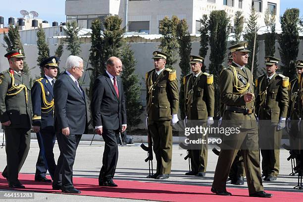 In this handout image supplied by the Palestinain Press Office , Palestinian President Mahmoud Abbas attends a welcome ceremony with Romanian...