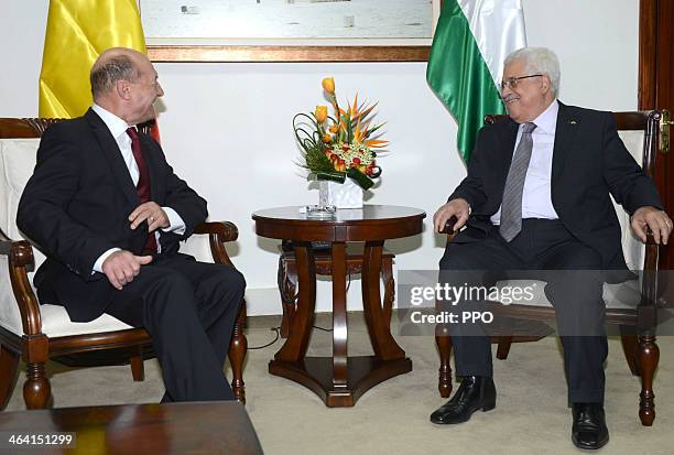 In this handout image supplied by the Palestinain Press Office , Palestinian President Mahmoud Abbas attends a meeting with Romanian President Traian...