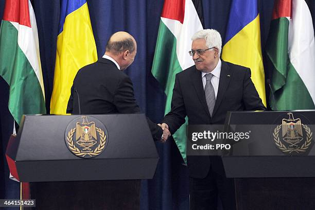 In this handout image supplied by the Palestinain Press Office , Palestinian President Mahmoud Abbas attends a press conference with Romanian...