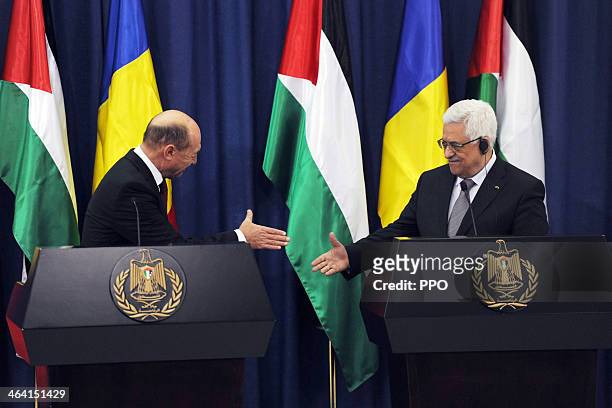 In this handout image supplied by the Palestinain Press Office , Palestinian President Mahmoud Abbas attends a press conference with Romanian...
