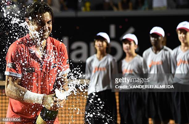 Spanish tennis player David Ferrer celebrates after winning his ATP Rio Open tournament final match against Italian Fabio Fognini in Rio de Janeiro,...