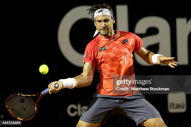 David Ferrer of Spain returns a shot to Fabio Fognini of Italy during the final of the Rio Open at the Jockey Club Brasileiro on February 22, 2015 in...