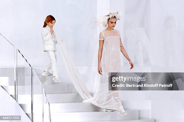 Model Cara Delevingne and godson of Karl Lagerfeld, Hudson Kroenig walk the runway during the Chanel show as part of Paris Fashion Week Haute-Couture...