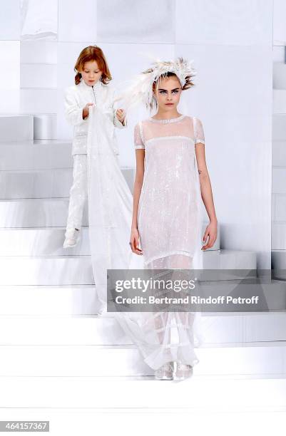 Model Cara Delevingne and godson of Karl Lagerfeld, Hudson Kroenig walk the runway during the Chanel show as part of Paris Fashion Week Haute-Couture...