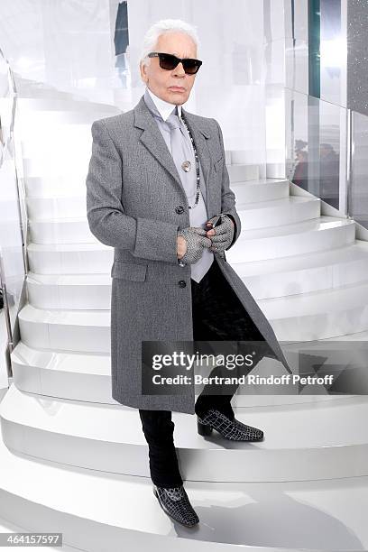 Fashion designer Karl Lagerfeld poses backstage after the Chanel show as part of Paris Fashion Week Haute Couture Spring/Summer 2014 on January 21,...
