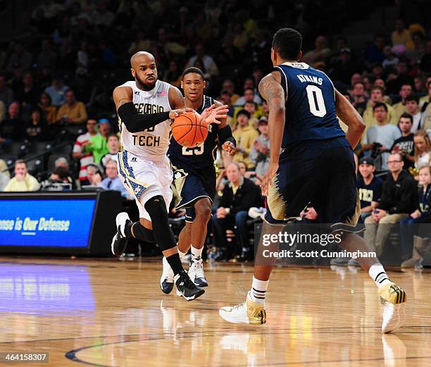 Trae Golden of the Georgia Tech Yellow Jackets drives against Eric Atkins of the Notre Dame Fighting Irish at McCamish Pavilion on January 11, 2014...