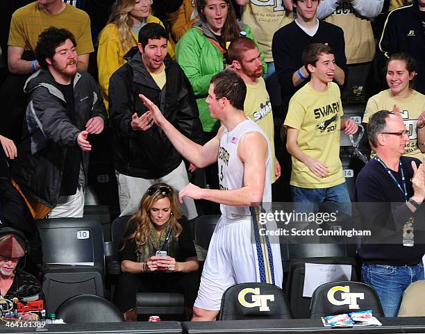 Daniel Miller of the Georgia Tech Yellow Jackets celebrates with fans after the game against the Notre Dame Fighting Irish at McCamish Pavilion on...