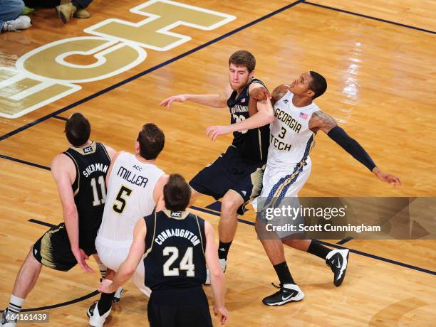 Marcus Georges-Hunt of the Georgia Tech Yellow Jackets boxes out against Austin Burgett of the Notre Dame Fighting Irish at McCamish Pavilion on...