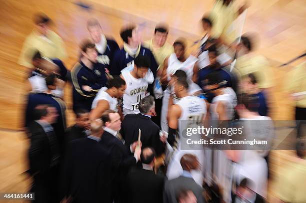 Members of the Georgia Tech Yellow Jackets huddle during the game against the Notre Dame Fighting Irish at McCamish Pavilion on January 11, 2014 in...